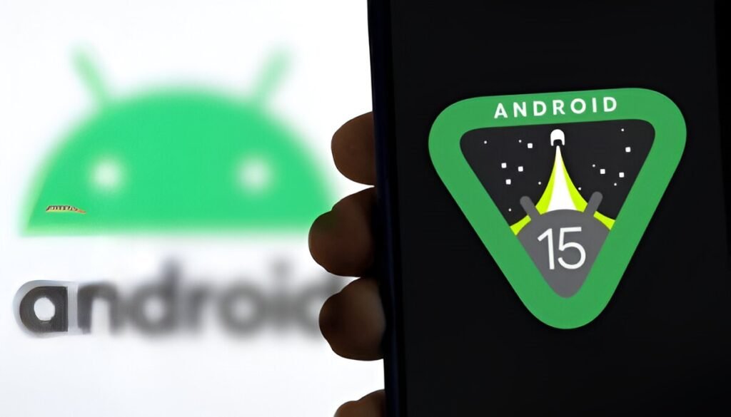Hand holding a smartphone displaying the Android 15 logo on screen, with the blurred Android mascot logo visible in the background