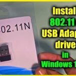 USB 2.0 802.11n wireless network adapter in retail packaging showing driver installation guide for Windows 10 and Windows 11 computers