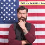 Man thinking about US area code history in front of American flag.